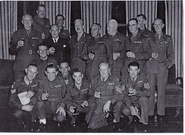 Frank Fisher, Army Warrant Officer left standing among Army Officers.