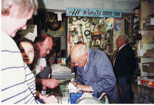George Robinson serving customers on the last day of business. 