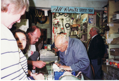 George Robinson serving customers on the last day of business. 