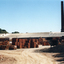 Photo taken of Daniel Robertson Brickworks Storage Area and Chimney, looking North towards Station Street.