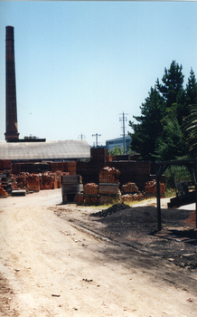 Photo taken of Daniel Robertson Brickworks Storage Area and Chimney, looking North towards Station Street.