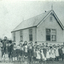 Black and white photo of Pupils outside Vermont State School in 1915.