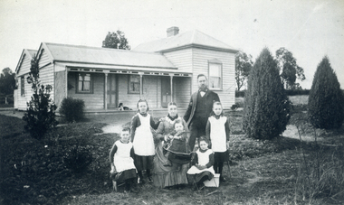 John Brown and Family outside their home in the then L.L. Vale Road (now Boronia Road) Vermont. 