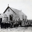 Vermont State School Pupils taken outside small wooden school in 1888.