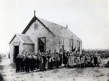 Vermont State School Pupils taken outside small wooden school in 1888.