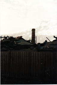 Vitclay Chimney, prior to demolition in 1995, with demolished shed in foreground. 