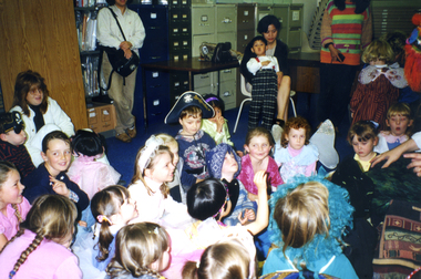 Fairies and Pirates being entertained by Jason the Fairy Tale Man at the 1999 Wisteria Party.