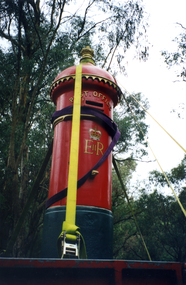 Coloured photo of restored Post Box being returned by an Australia Post truck