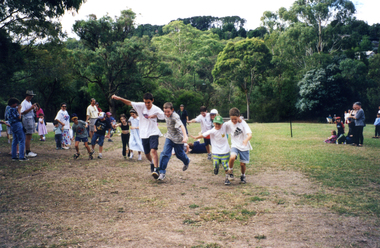 Children taking part in 3-legged race during Society's Open Day at Schwerkolt Cottage & Museum Complex during Heritage Festival 2000.
