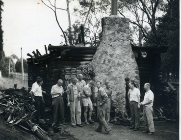 Toc H Members inspecting damage to Mitcham Branch's log cabin in March 1960|