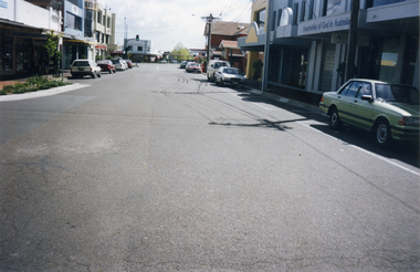 Station Street Mitcham looking north. Trees on Mitcham Mall (formerly Britannia Street) in distance