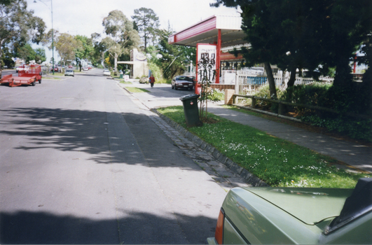 North Service Road in Whitehorse Road, Mitcham, looking west to shop and Service Station on the corner of Alexander Street Mitcham.