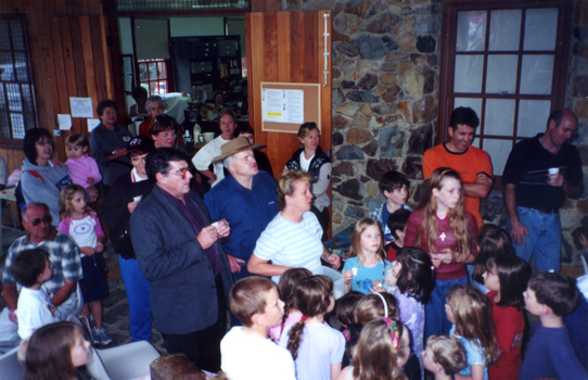 Crowd gathered around Mayor Bill Bowie and Council Officer, Julie Jones, drawing Raffle on Open Day, 2001.