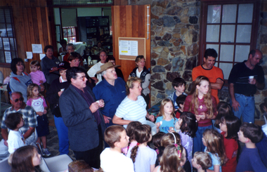 Crowd gathered around Mayor Bill Bowie and Council Officer, Julie Jones, drawing Raffle on Open Day, 2001.