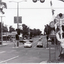 Black and white photograph of Blackburn Road, Blackburn looking south fro railway crossing.