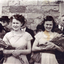 Joyce Suto ( nee Baker) on left. Bridesmaid dress is of gold nylon with olive green sash. Worn at wedding in Gloucestshire, England on 8th April 1947.