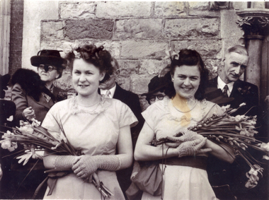 Joyce Suto ( nee Baker) on left. Bridesmaid dress is of gold nylon with olive green sash. Worn at wedding in Gloucestshire, England on 8th April 1947.