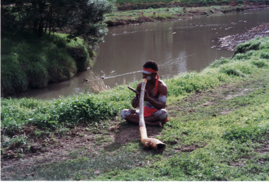 An aborigine playing Didgeridoo at opening of Whitehorse Heritage Trail at Gardiners Creek Reserve, Burwood