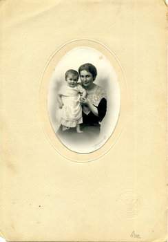 In the middle of a cream background, Mary Matheson and her daughter, Marjorie as a baby.