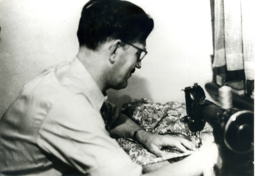 Herbert (Bert) Lingard at his sewing machine.