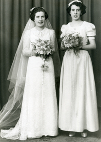 Black and white photograph of Mavis Brown in her Wedding dress with her sister Bette (married name Jones).
