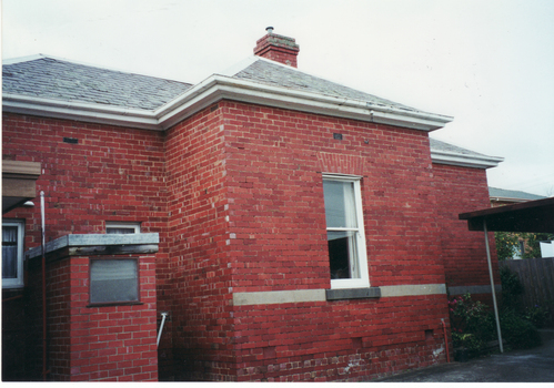 Coloured  photograph of the side view of the original home of Mr. Edward and Mrs. Mary Pearce built in 1870s. 