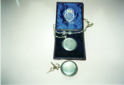 Coloured photograph of of watches belonging to  W.S.Slater and Edward Pearce, husband of Mary. Watch in box made by Bennett 