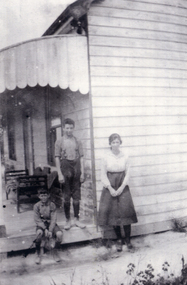 Black and white photograph of Fred Cecil and Blanche Collier outside the home in Tunstall.