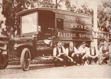 Nunawading Shire Electric Supply - early 1920s - showing truck and five men squatting beside it. 