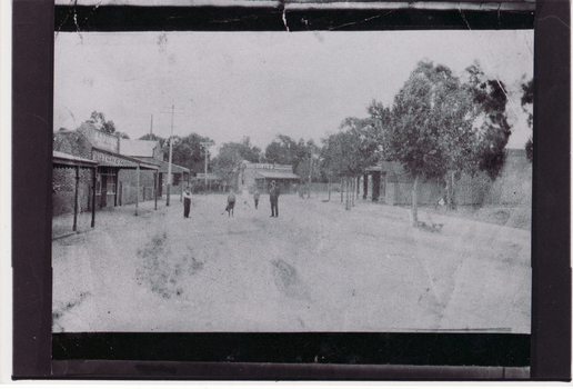 Black/white - Very early photo of beginning of Blackburn Road looking north towards railway crossing