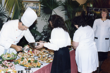  Chef and waitress arranging the food for the reception for Bob Hawke, Prime Minister, when he visited Nunawading in 1989. 