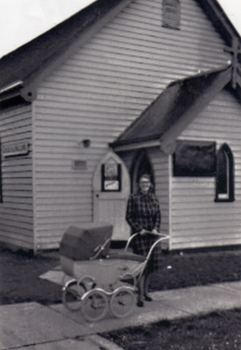 Christ Church, Mitcham, in Edward Street in 1952. Mrs. P. Grant in front with her baby, Paul following his christening