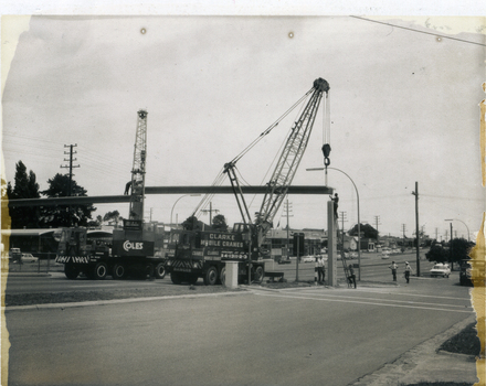 Placing spans for pedestrian overpass in position. Whitehorse Road and Peel Street intersection, Mitcham