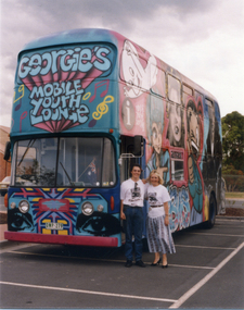 staff standing beside Georgie's Mobile Youth Lounge