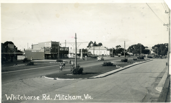 Whitehorse Road, Mitcham looking east from Station Street corner shops on eastern side and white heading 'Whitehorse Rd Mitcham, Vic.'