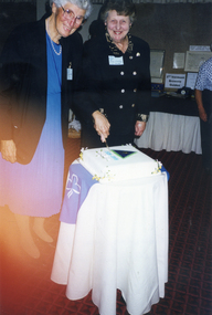 Lucy Courtney and Jessie Cuttle cutting the cake at the Vermont Girl Guides 70th Anniversary at St John's Hall, Vermont in 1999
