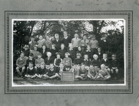 Grade 2, Mitcham State School c.1946, surrounded by decorative border.