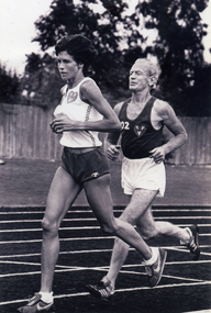 Dot Browne running on an athletics track.