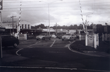 Black & white photograph of he precinct surrounding the Nunawading Station and the Springvale Road Railway crossing.