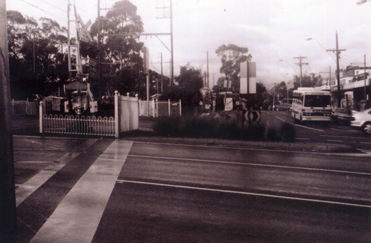 Black & white photograph of the precinct surrounding the Nunawading Station and the Springvale Road Railway crossing. 