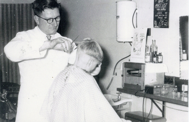 Arthur Riley in his Rangeview barber shop in the late 1950's.
