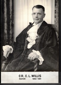 Photograph of Councillor C. L. (Jim) Willis in his mayoral robes seated on a chair. 
