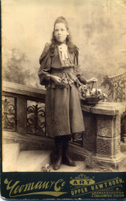 Teen-age girl with dark hair worn long.