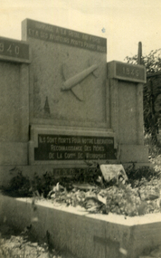 gravestone in Werhmont cemetery with aeroplane in relief.