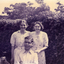  Mrs Till and Alison Till both standing behind Alwyn Till.