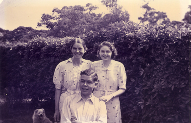  Mrs Till and Alison Till both standing behind Alwyn Till.