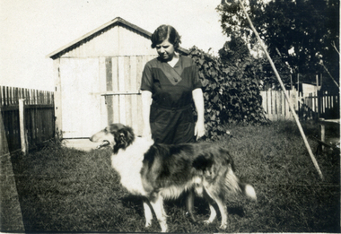 Woman with a Collie dog.