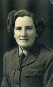 a dark-haired woman in service uniform