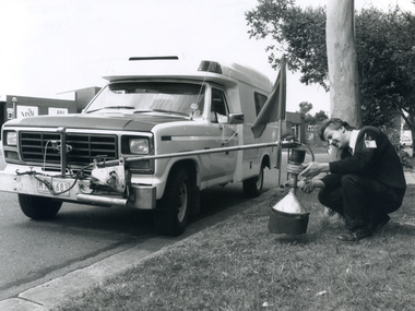 Gas and Fuel employee using a device called a 'sniffer' which is used to detect gas leaks. 