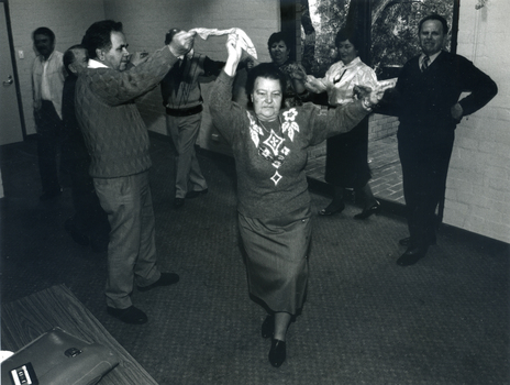  Greek elderly citizens performing a traditional Greek dance. 